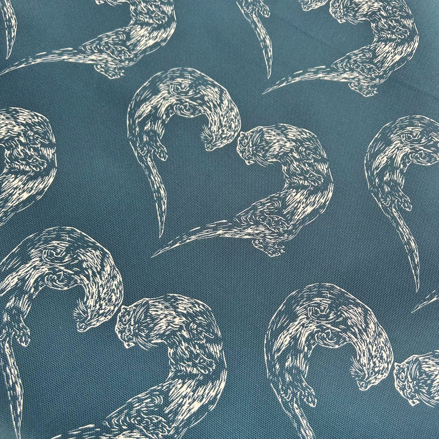 Swimming Otters Tea Towel