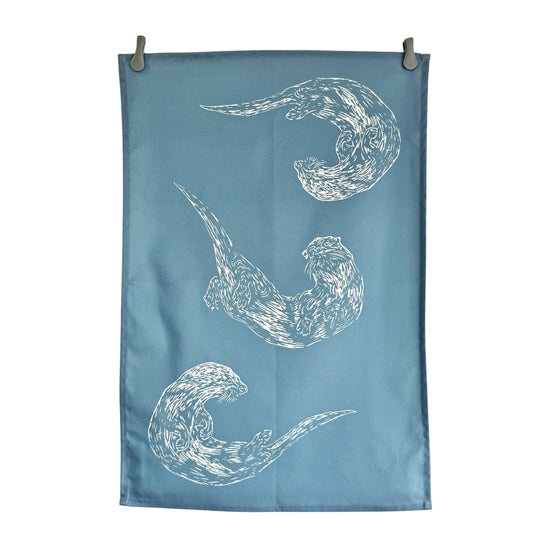 Swimming Otters Blue Tea Towel
